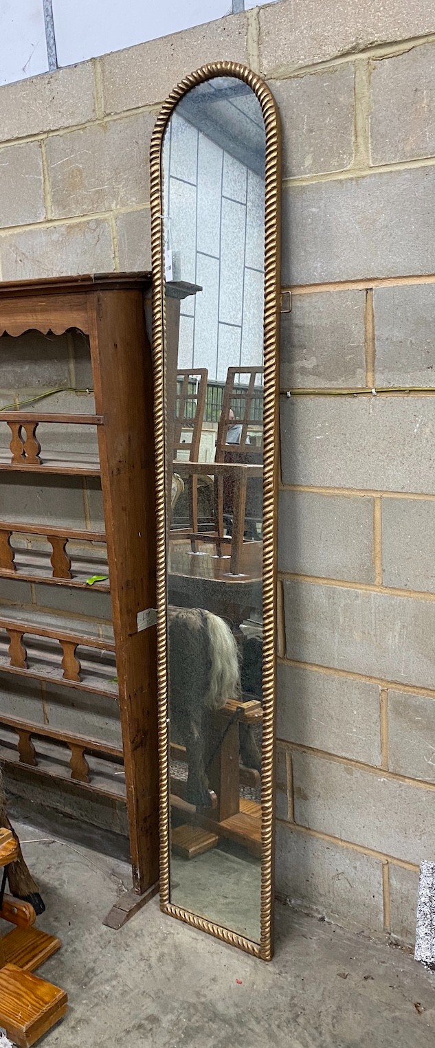 A gilt composition framed wall mirror, width 36cm height 214cm